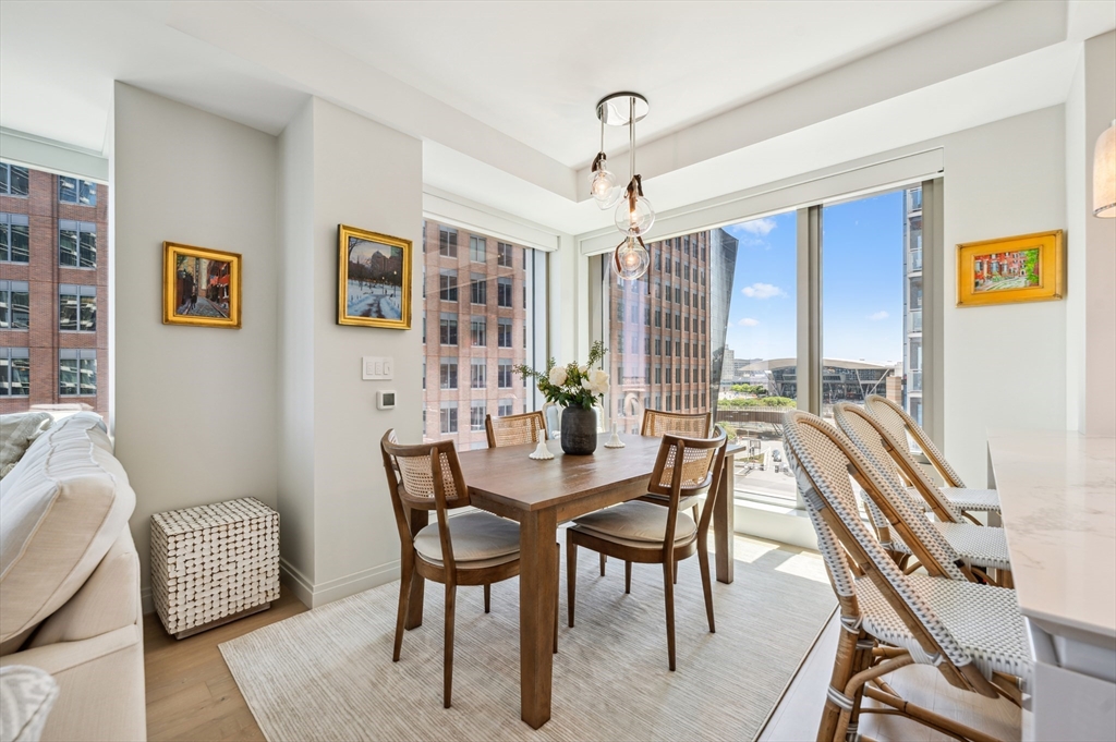 133 Seaport Boulevard, Unit 823 Boston, MA 02210 - Photo 3 of 31 a view of a livingroom with furniture and window