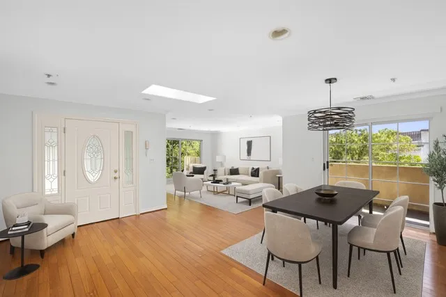 a view of a dining room with furniture window and outside view