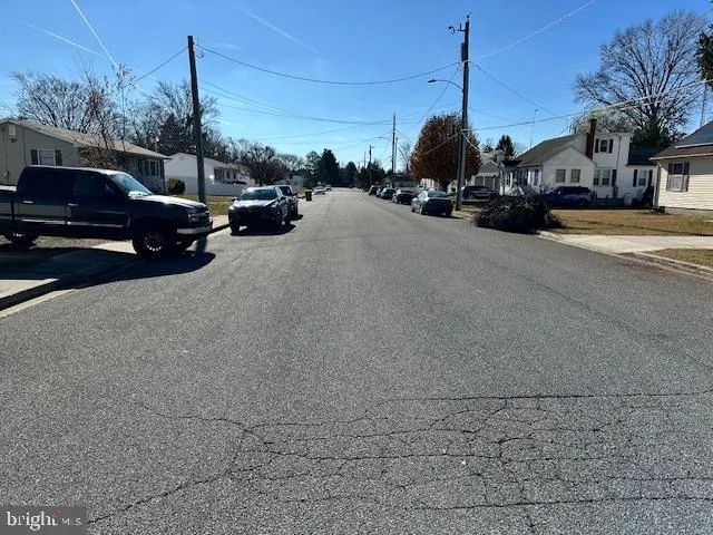 a view of street with parked cars