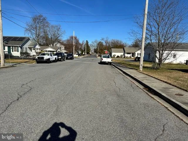 a view of road with card parked on road