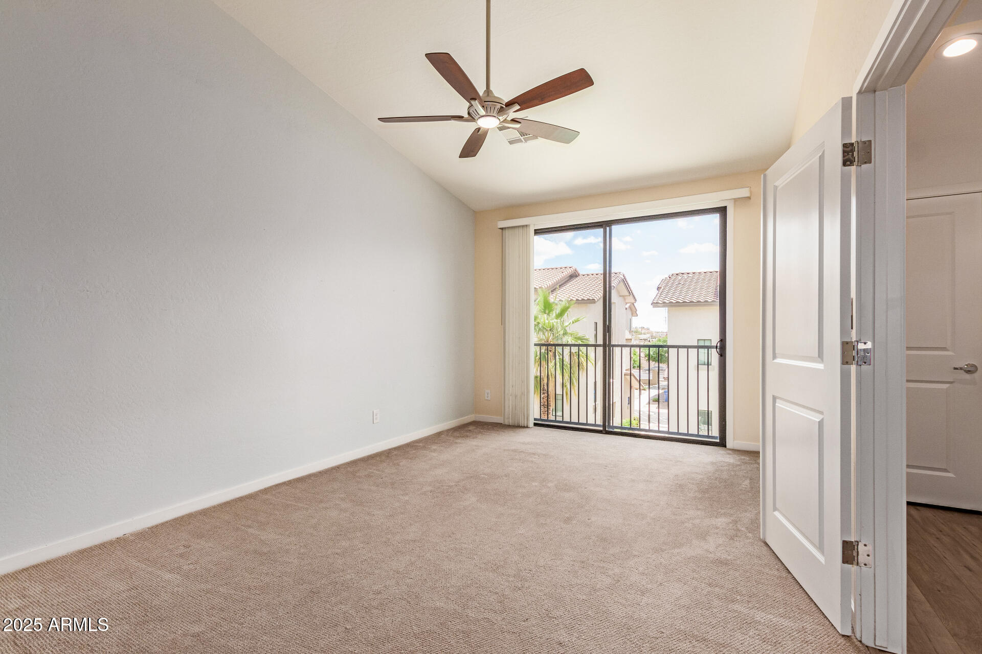 2315 North 52nd Street, Unit 144 Phoenix, AZ 85008 - Photo 12 of 28 a view of a livingroom with a ceiling fan and window