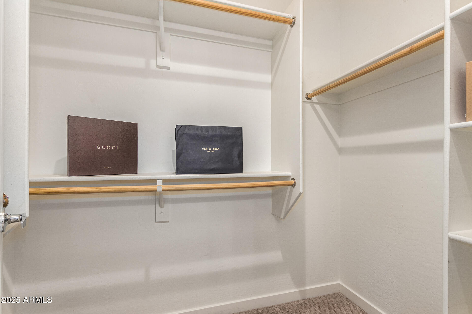 2315 North 52nd Street, Unit 144 Phoenix, AZ 85008 - Photo 13 of 28 a view of an empty walk in closet
