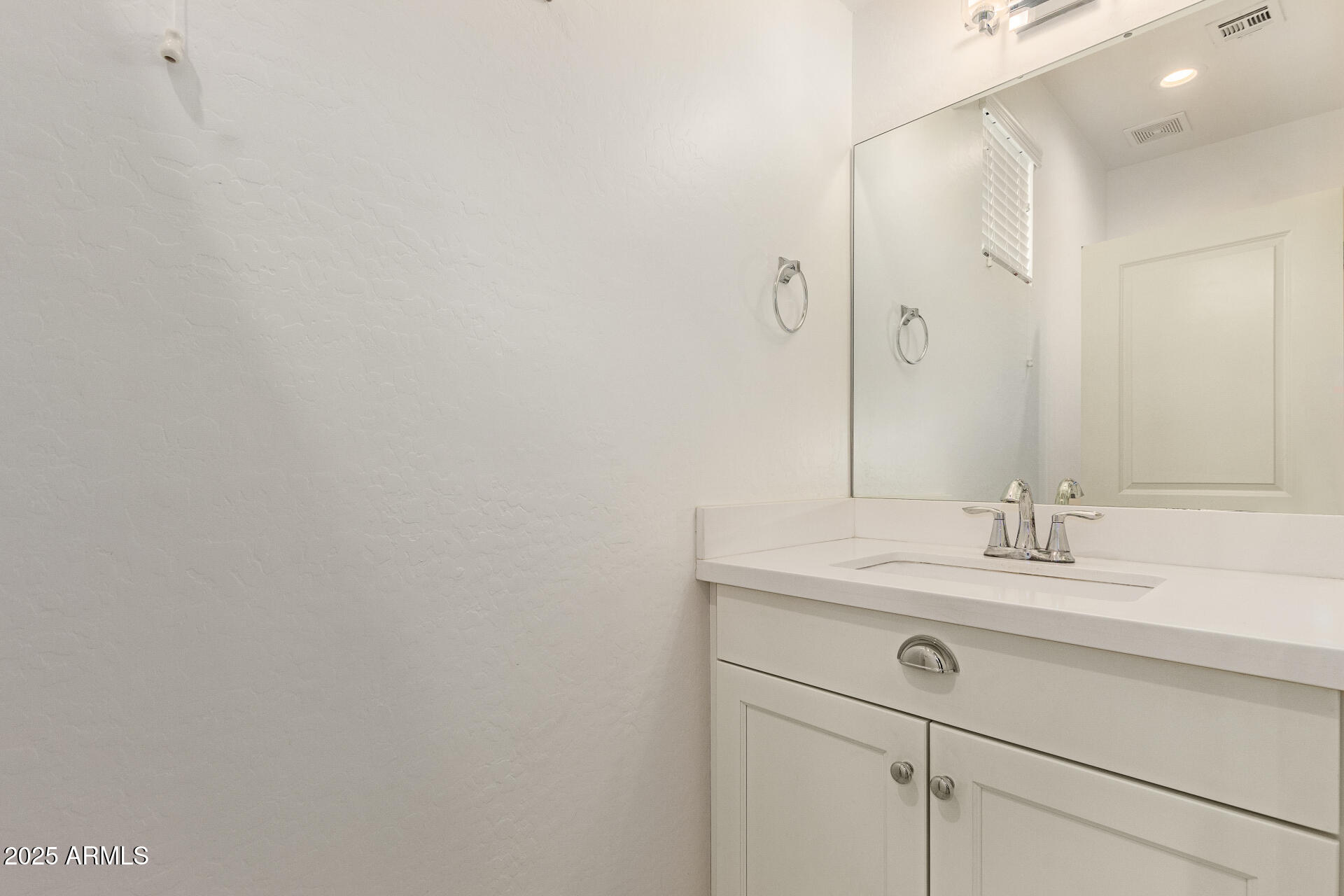 2315 North 52nd Street, Unit 144 Phoenix, AZ 85008 - Photo 14 of 28 a bathroom with a sink and a mirror