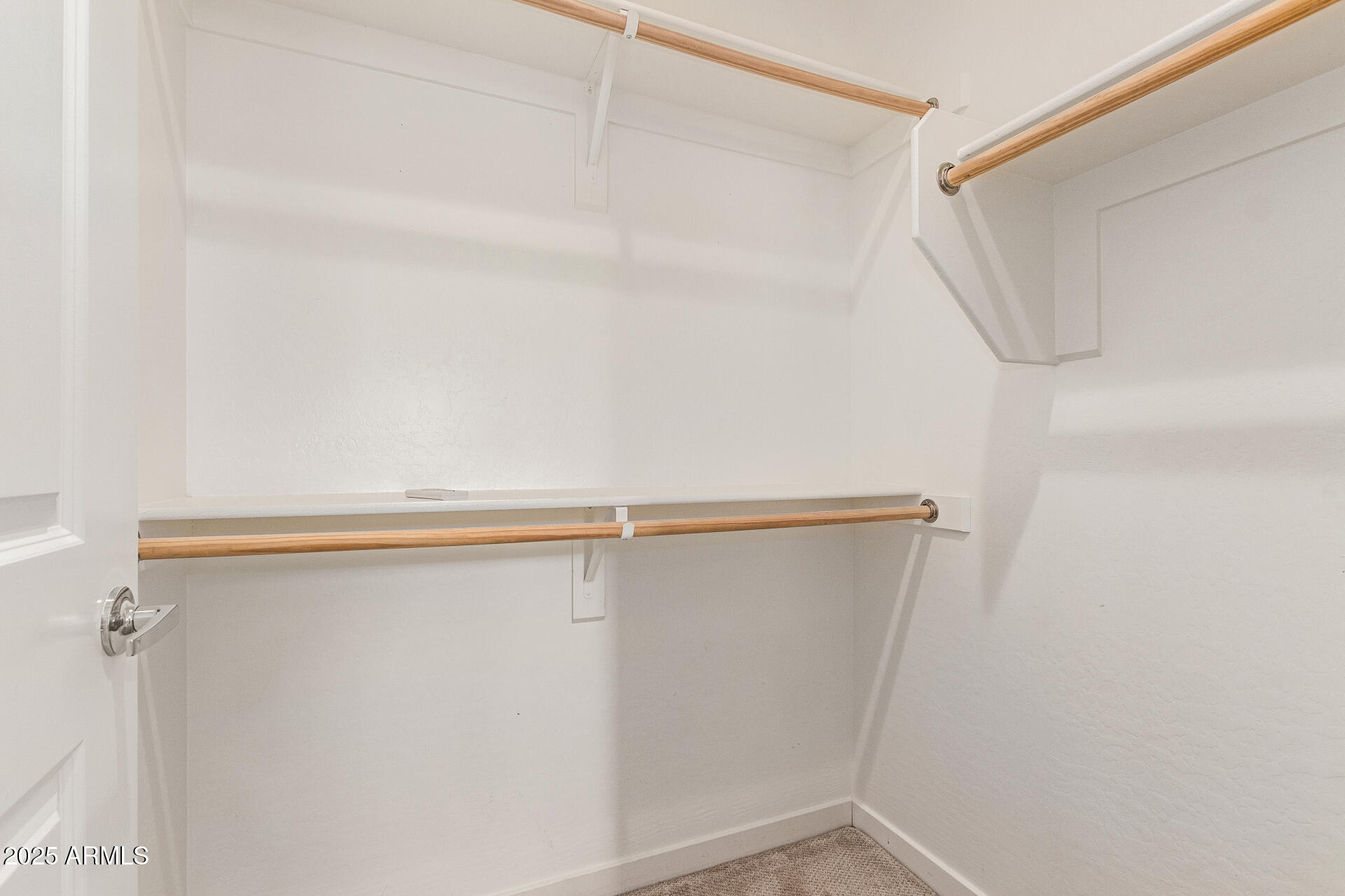 2315 North 52nd Street, Unit 144 Phoenix, AZ 85008 - Photo 19 of 28 a view of walk in closet with empty racks
