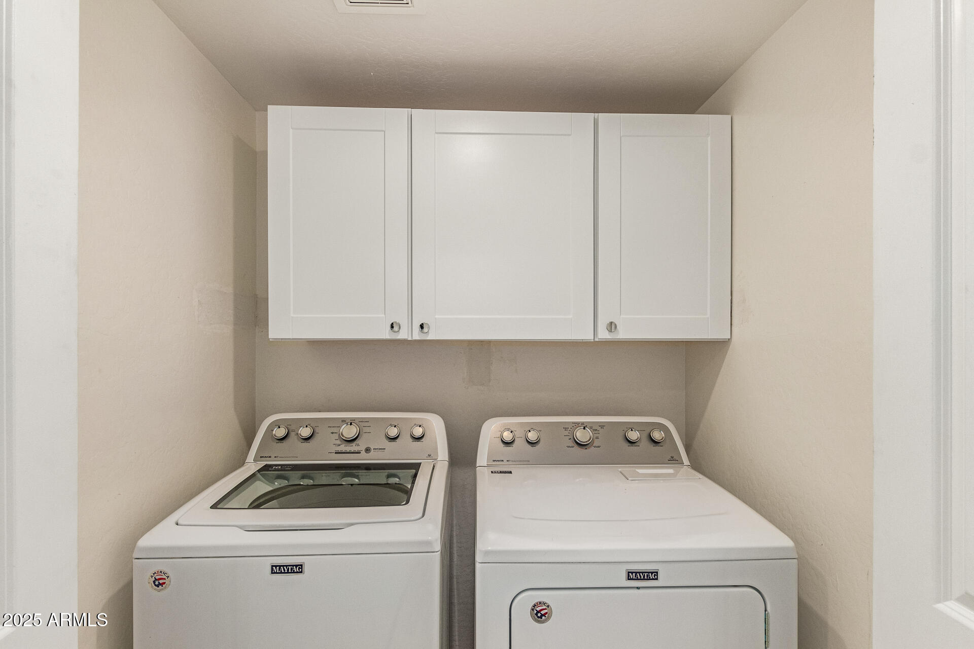 2315 North 52nd Street, Unit 144 Phoenix, AZ 85008 - Photo 21 of 28 a view of storage and utility room with washer and dryer