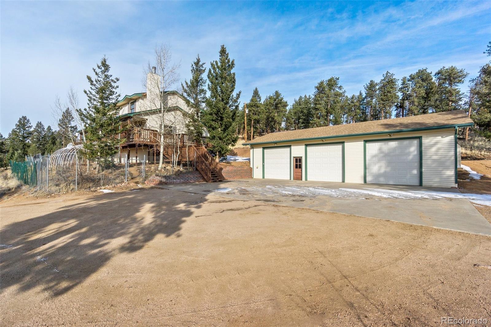 1602 Hitchrack Road Bailey, CO 80421 - Photo 3 of 4 front view of a house with a street