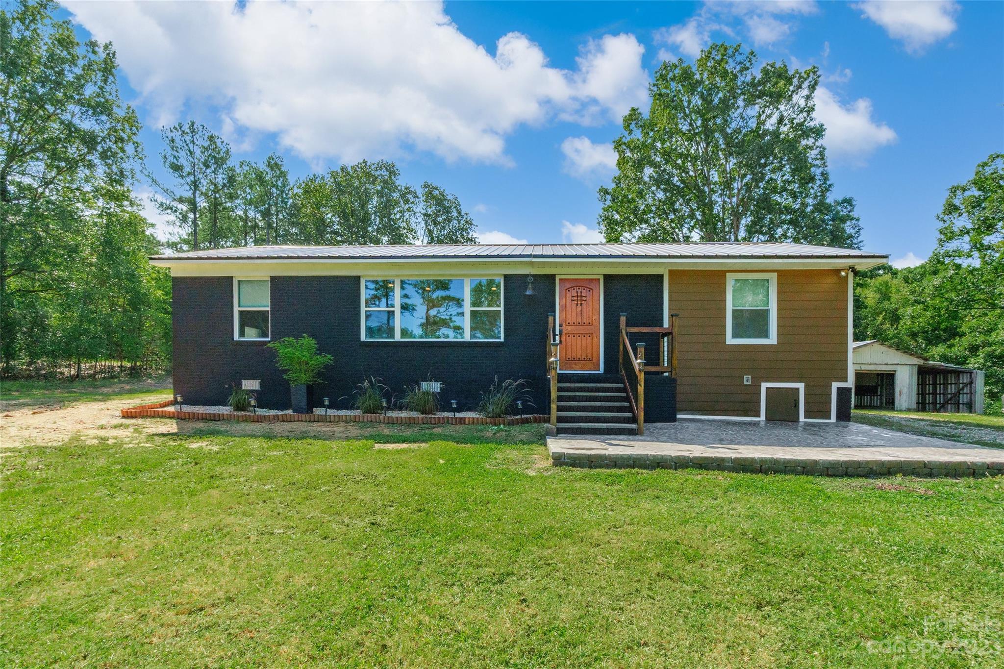front view of a house with a yard