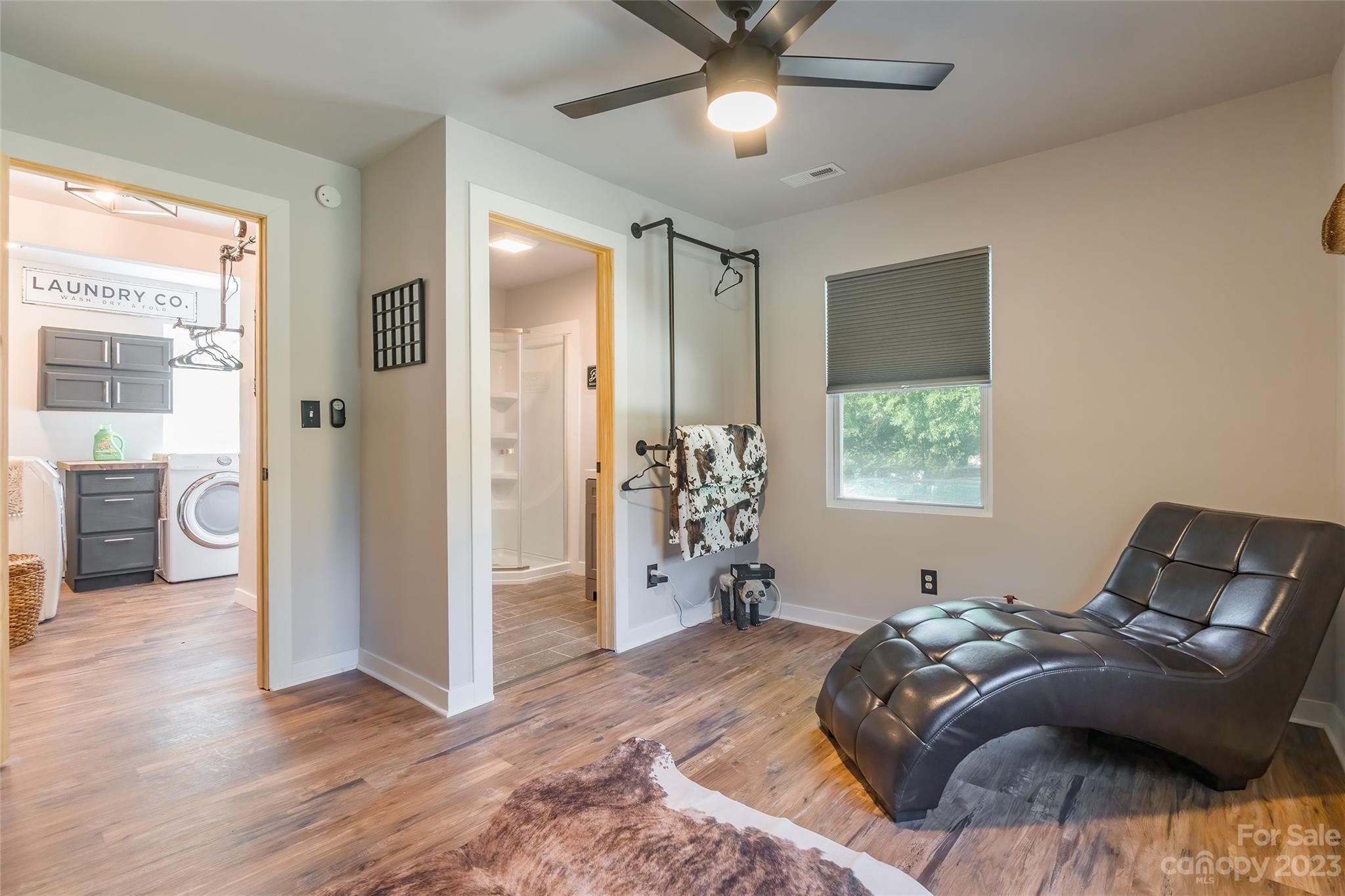 177 State Rd S-29-70 Lancaster, SC 29720 - Photo 14 of 30 a bedroom with a bed and a chandelier