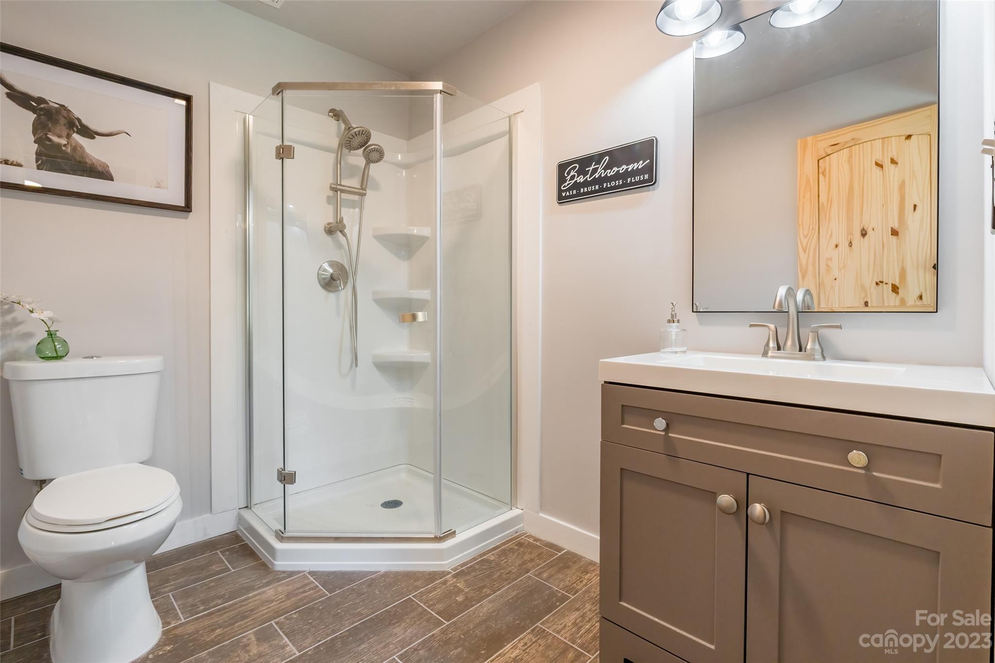 177 State Rd S-29-70 Lancaster, SC 29720 - Photo 15 of 30 a bathroom with a shower sink vanity and toilet