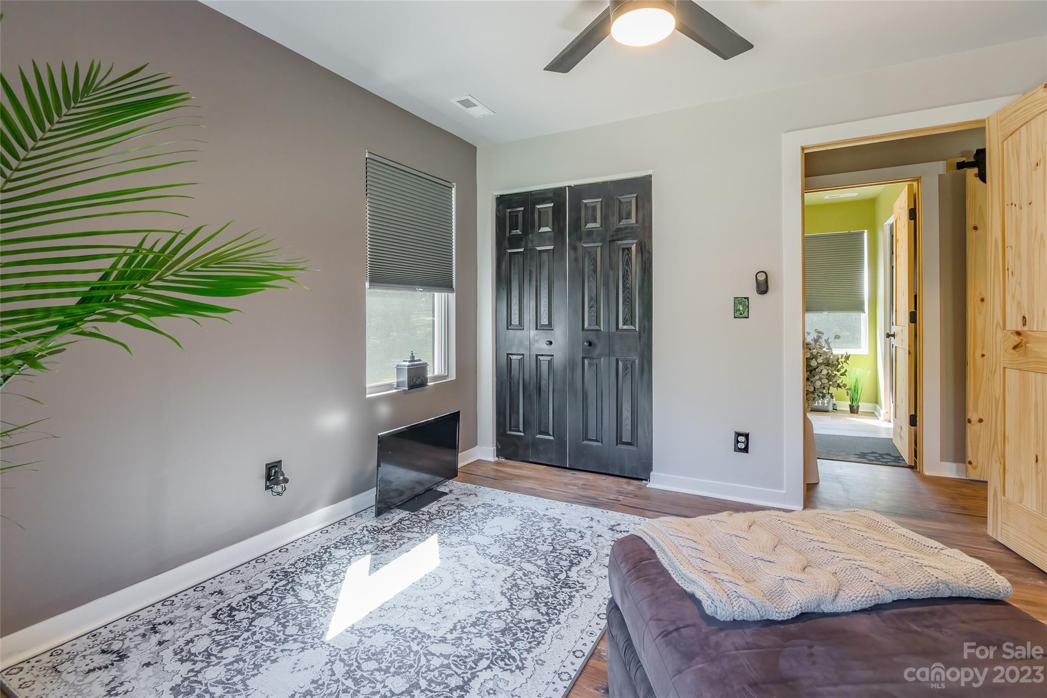 177 State Rd S-29-70 Lancaster, SC 29720 - Photo 17 of 30 a spacious bedroom with a bed and a chandelier
