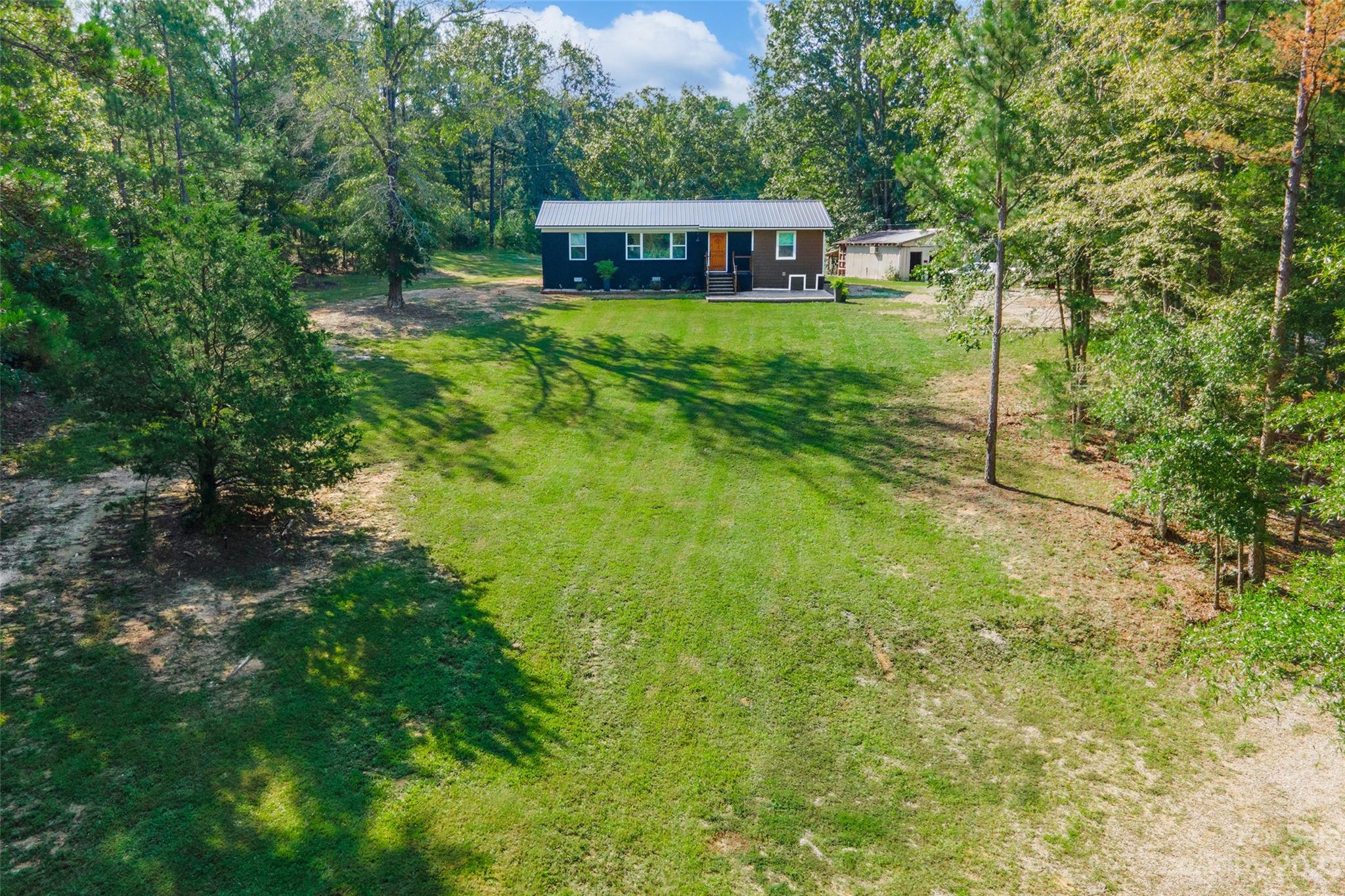 177 State Rd S-29-70 Lancaster, SC 29720 - Photo 2 of 30 a view of a house with backyard