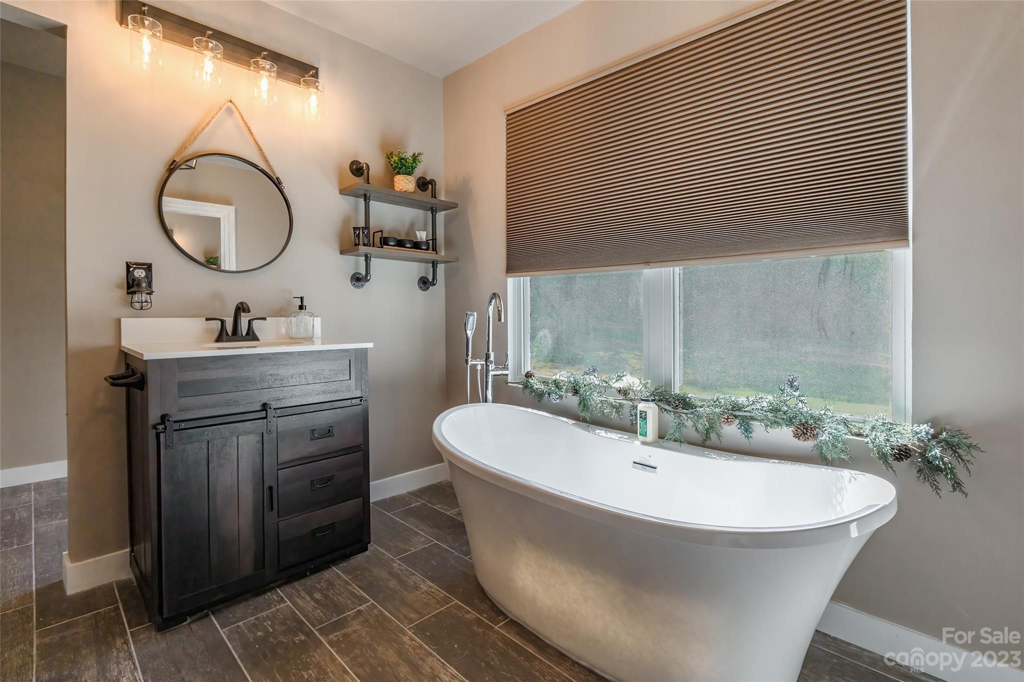 177 State Rd S-29-70 Lancaster, SC 29720 - Photo 22 of 30 a bathroom with a sink and a mirror