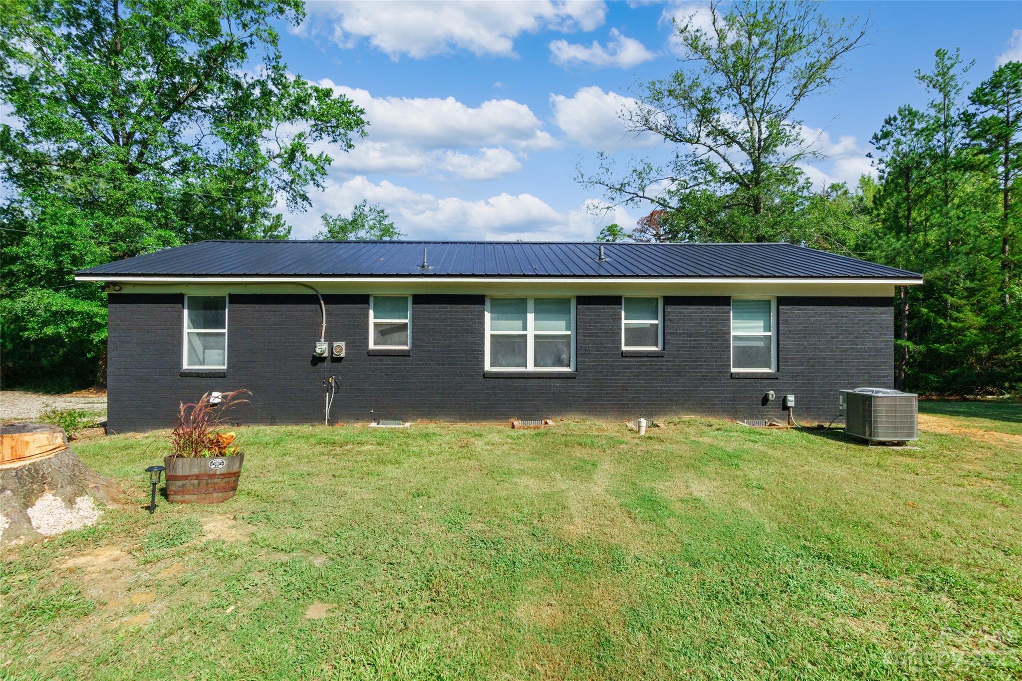 177 State Rd S-29-70 Lancaster, SC 29720 - Photo 26 of 30 a backyard of a house with yard and outdoor seating