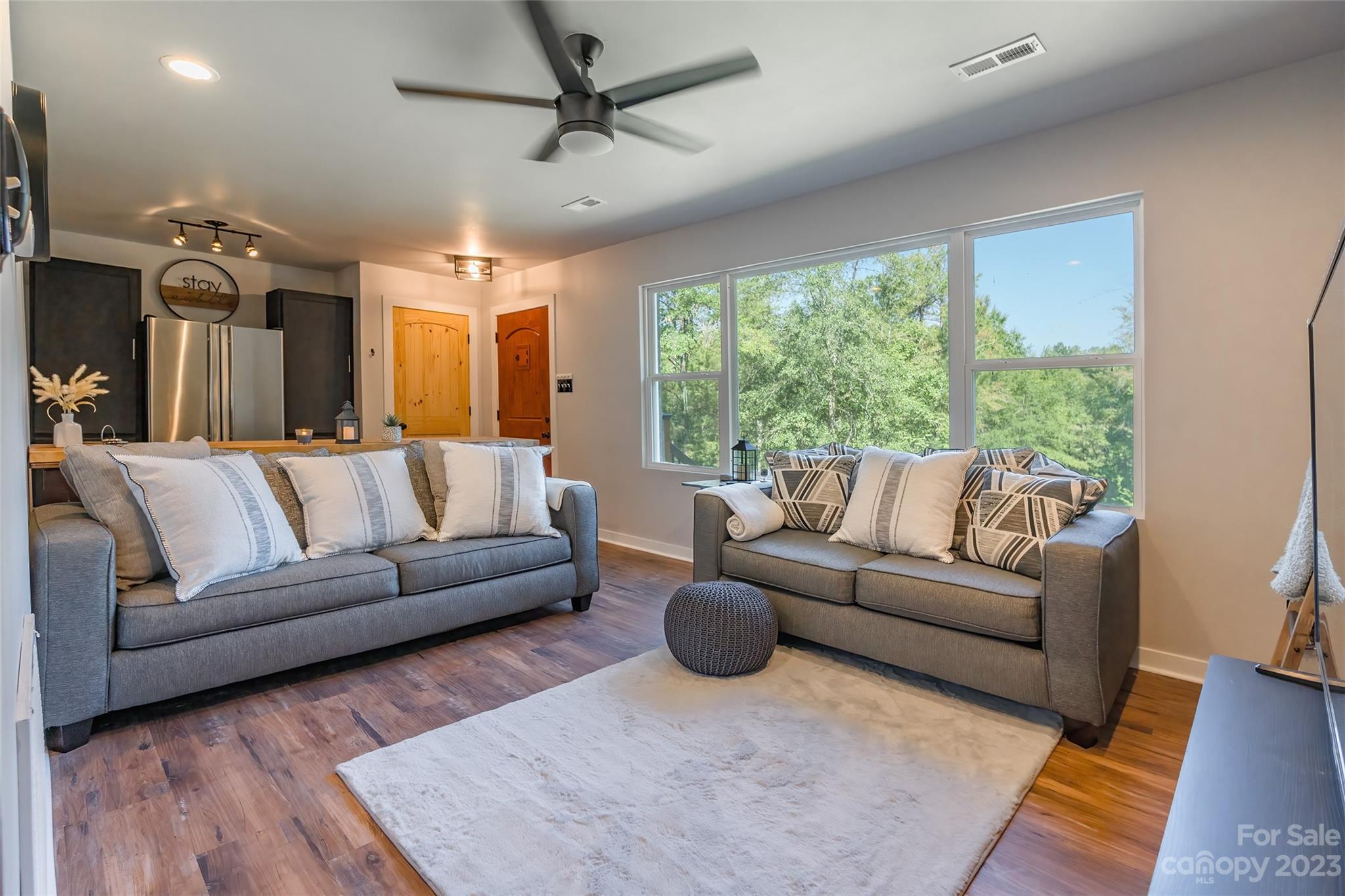 177 State Rd S-29-70 Lancaster, SC 29720 - Photo 9 of 30 a living room with furniture and a large window