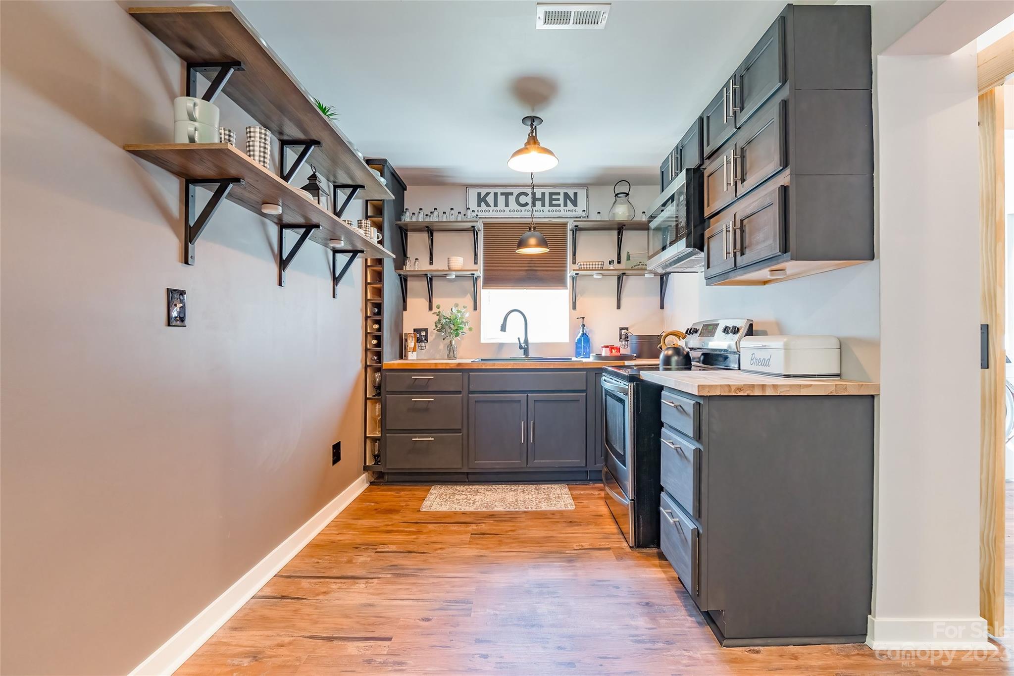 177 State Rd S-29-70 Lancaster, SC 29720 - Photo 10 of 30 a kitchen with stainless steel appliances granite countertop a refrigerator and a stove