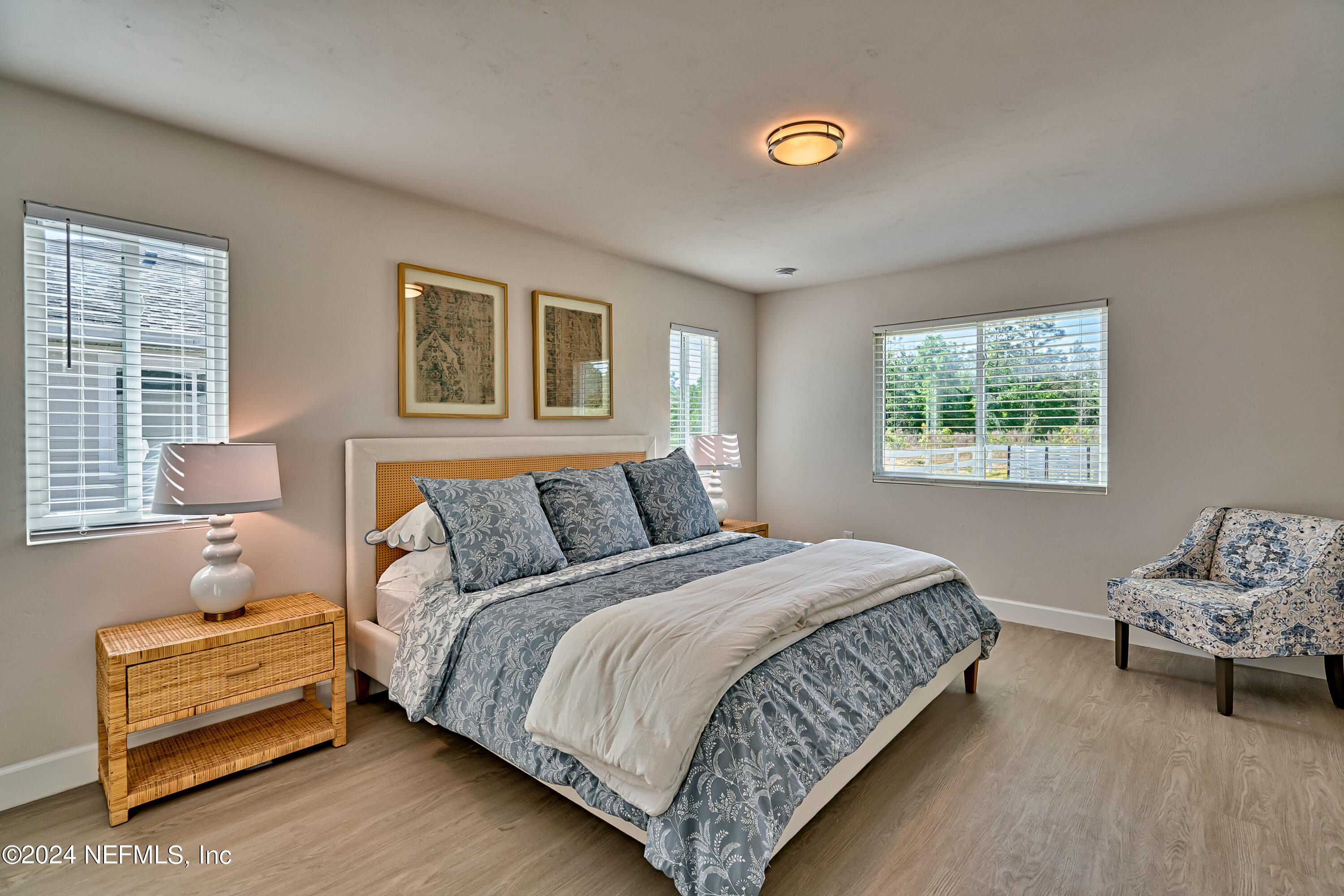 218 Portland Street Hawthorne, FL 32640 - Photo 54 of 66 a bedroom with a bed and a couch