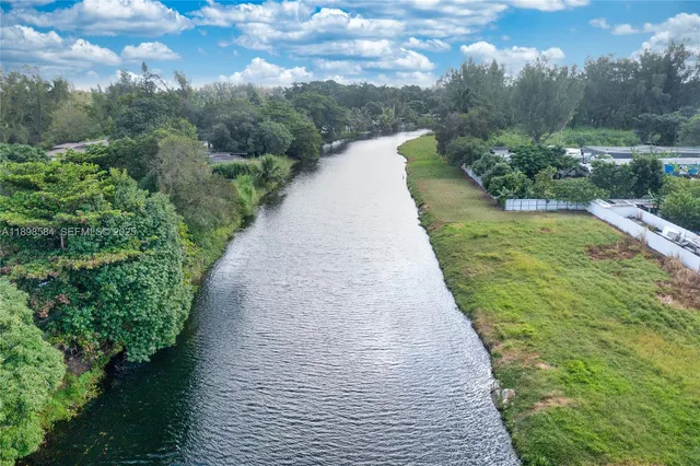a view of a pathway with a yard