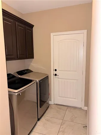 a utility room with washer and dryer