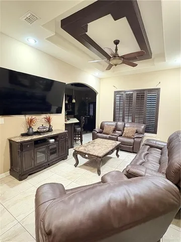a living room with furniture and a table