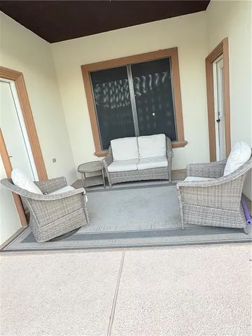 a living room with furniture and a window