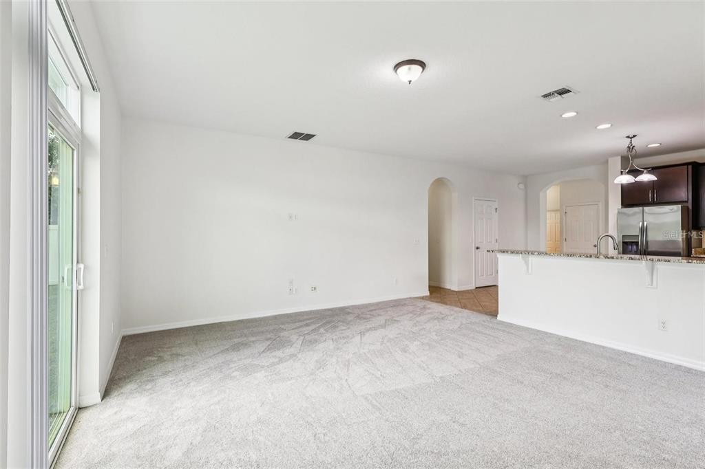 1126 Maumee Street Orlando, FL 32828 - Photo 14 of 21 a view of a kitchen with a sink and a refrigerator