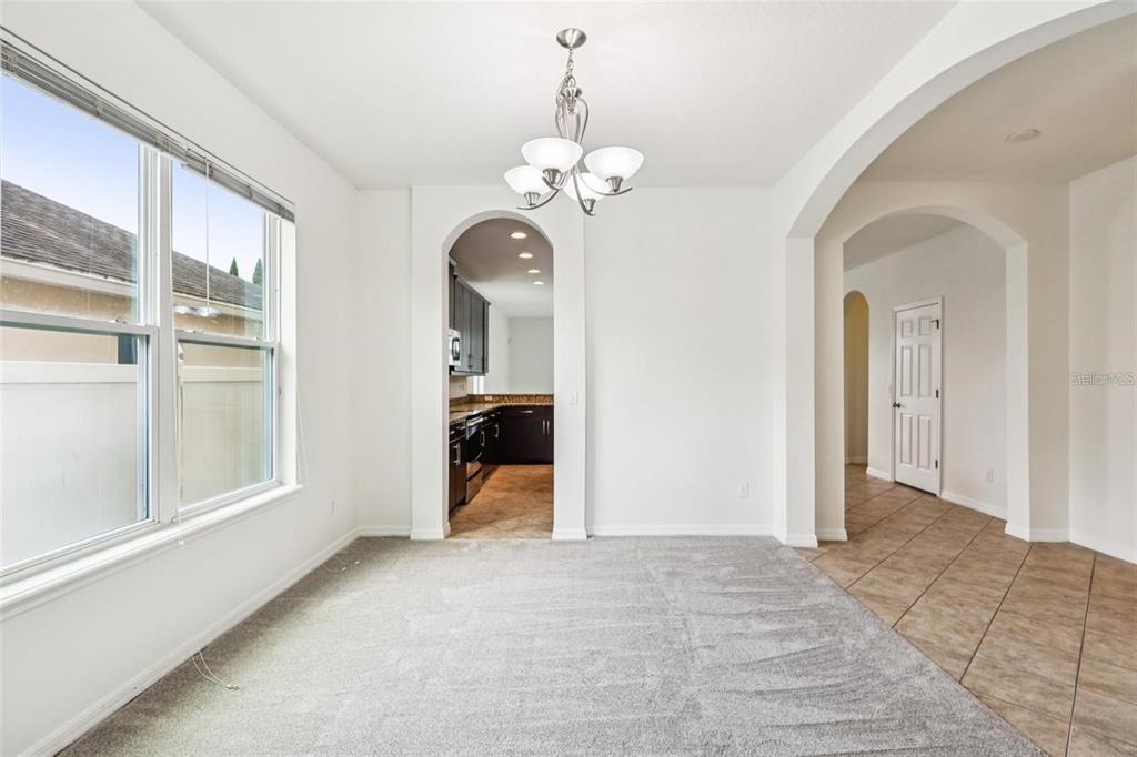 1126 Maumee Street Orlando, FL 32828 - Photo 3 of 21 a view of a room with a large windows and ceiling fan