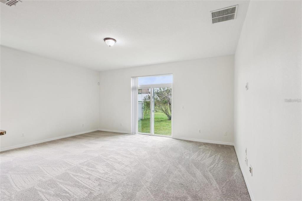 1126 Maumee Street Orlando, FL 32828 - Photo 8 of 21 a view of an empty room with a window