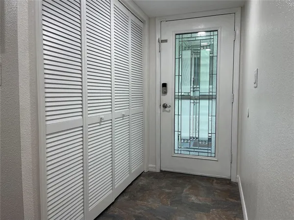 a large kitchen with stainless steel appliances kitchen island granite countertop a refrigerator a oven a sink and dishwasher