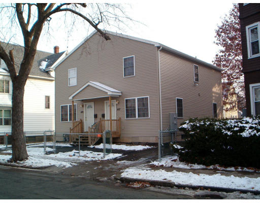 407 Orange Street Springfield, MA 01108 - Photo 1 of 1 a front view of a house with garden