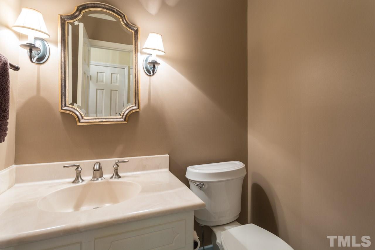 10205 Bushveld Lane Raleigh, NC 27613 - Photo 15 of 22 Half bath off the foyer convenient for guests