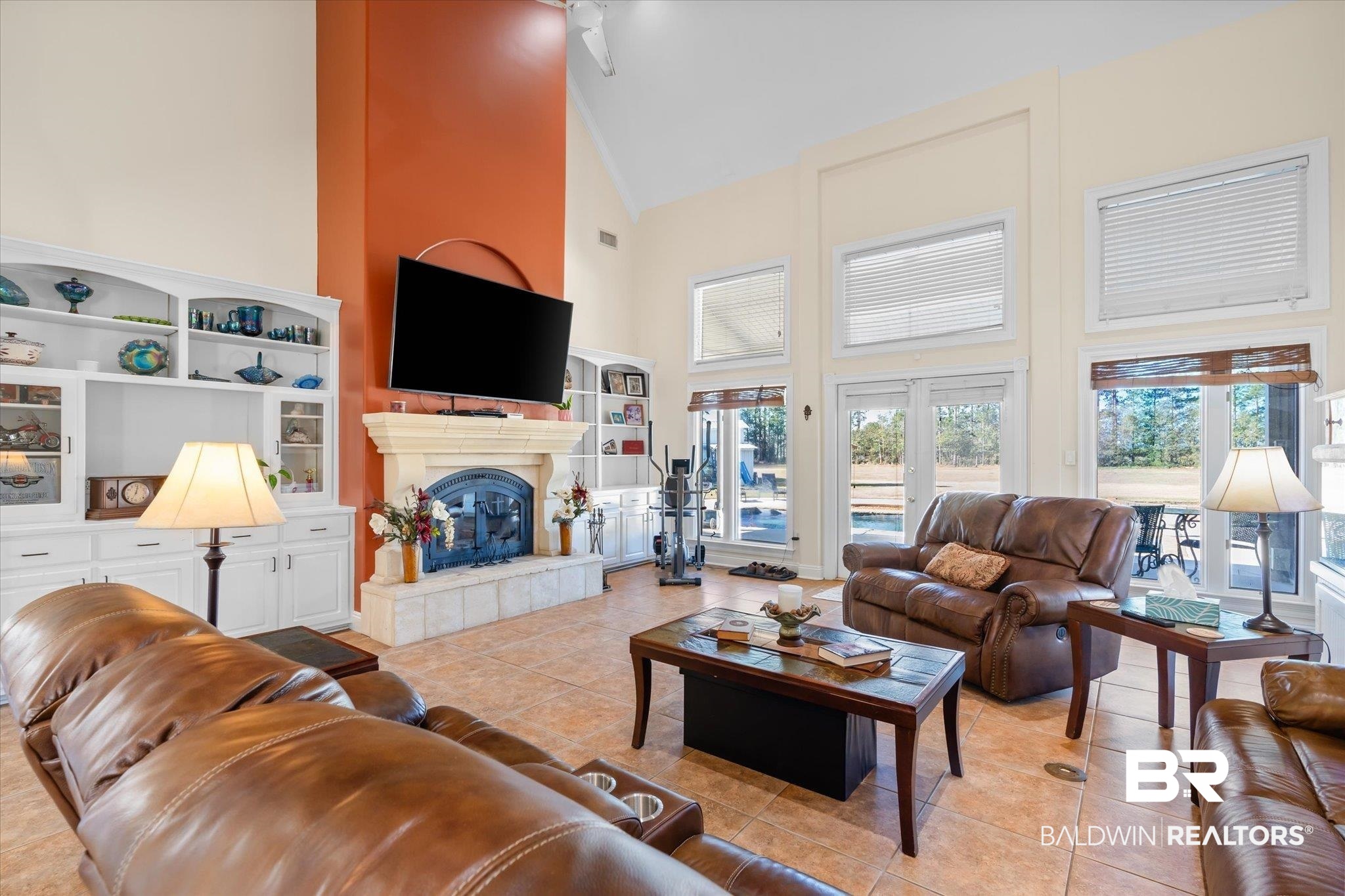 15635 County Road 83 Elberta, AL 36530 - Photo 4 of 54 Tiled living room featuring a fireplace, french doors, and high vaulted ceiling