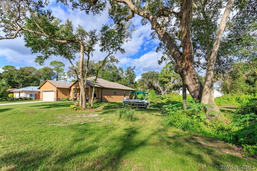 141 Poinciana Road Edgewater, FL 32141 - Photo 22 of 26 a view of backyard of house