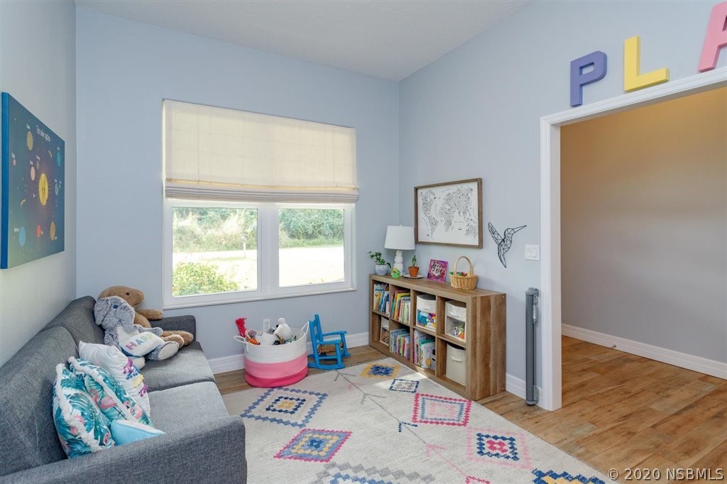 141 Poinciana Road Edgewater, FL 32141 - Photo 6 of 26 a living room with furniture and a window