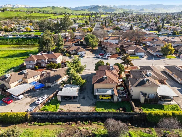 an aerial view of residential houses with outdoor space