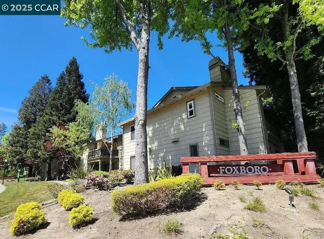 a view of a street with a building in the background