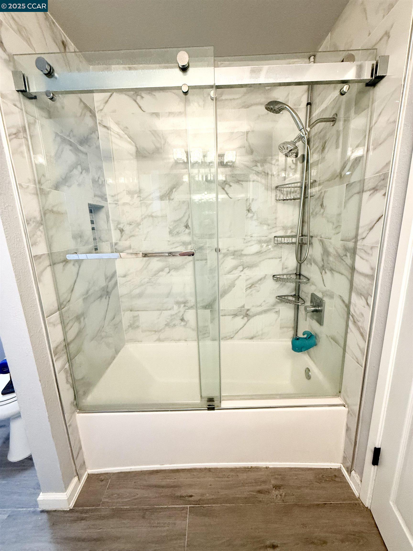 405 Weymouth Hercules, CA 94547 - Photo 15 of 21 a bathroom with a bathtub and a shower