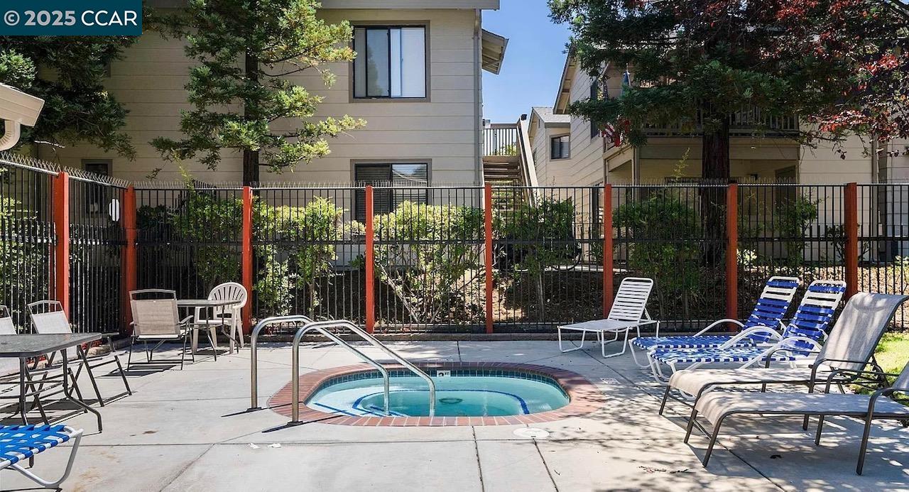 405 Weymouth Hercules, CA 94547 - Photo 18 of 21 a view of a patio with dining table and chairs and potted plants