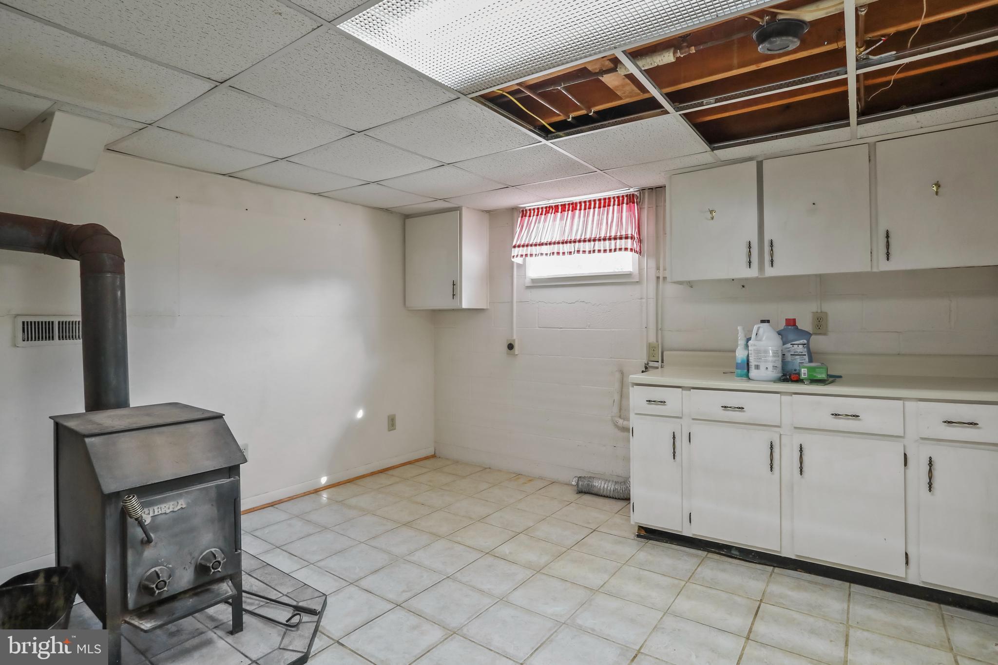 51 Waterfall Road Chester Gap, VA 22623 - Photo 20 of 24 Laundry room with woodstove