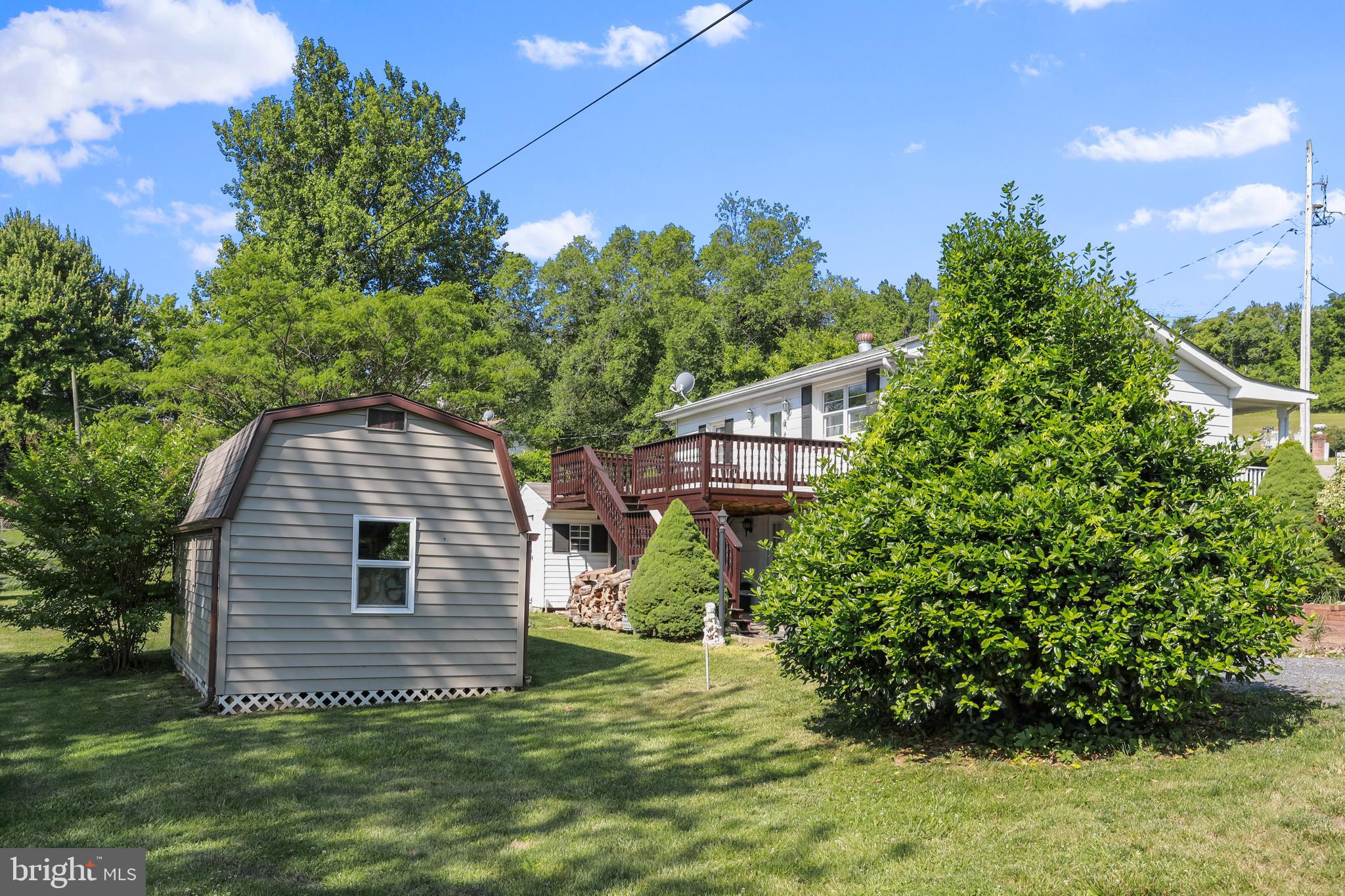 51 Waterfall Road Chester Gap, VA 22623 - Photo 23 of 24 Rear of home and two storage sheds
