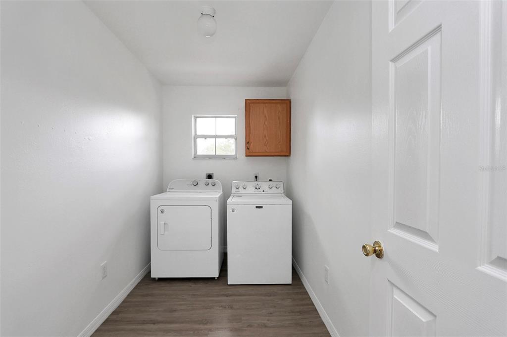 10648 Southwest 38th Avenue Ocala, FL 34476 - Photo 14 of 52 a utility room with a washer and dryer
