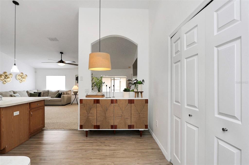 10648 Southwest 38th Avenue Ocala, FL 34476 - Photo 16 of 52 a living room with furniture and a fireplace