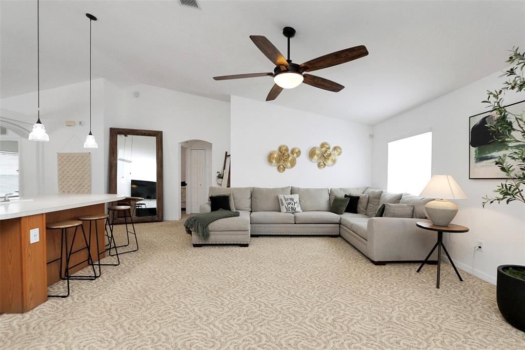 10648 Southwest 38th Avenue Ocala, FL 34476 - Photo 20 of 52 a living room with furniture and a large window