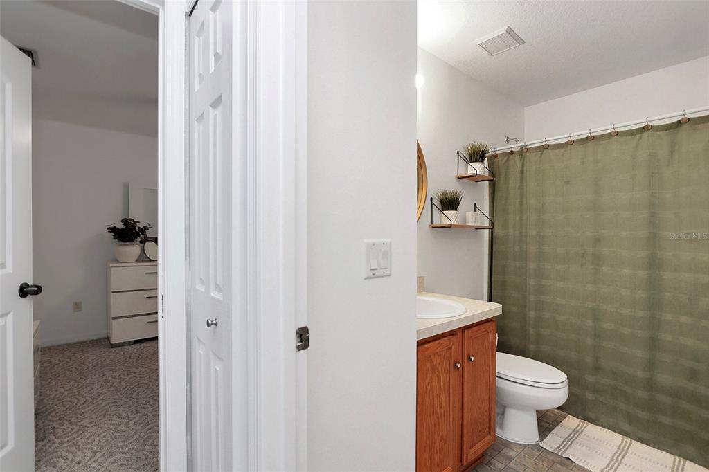 10648 Southwest 38th Avenue Ocala, FL 34476 - Photo 37 of 52 a bathroom with a sink a toilet and shower