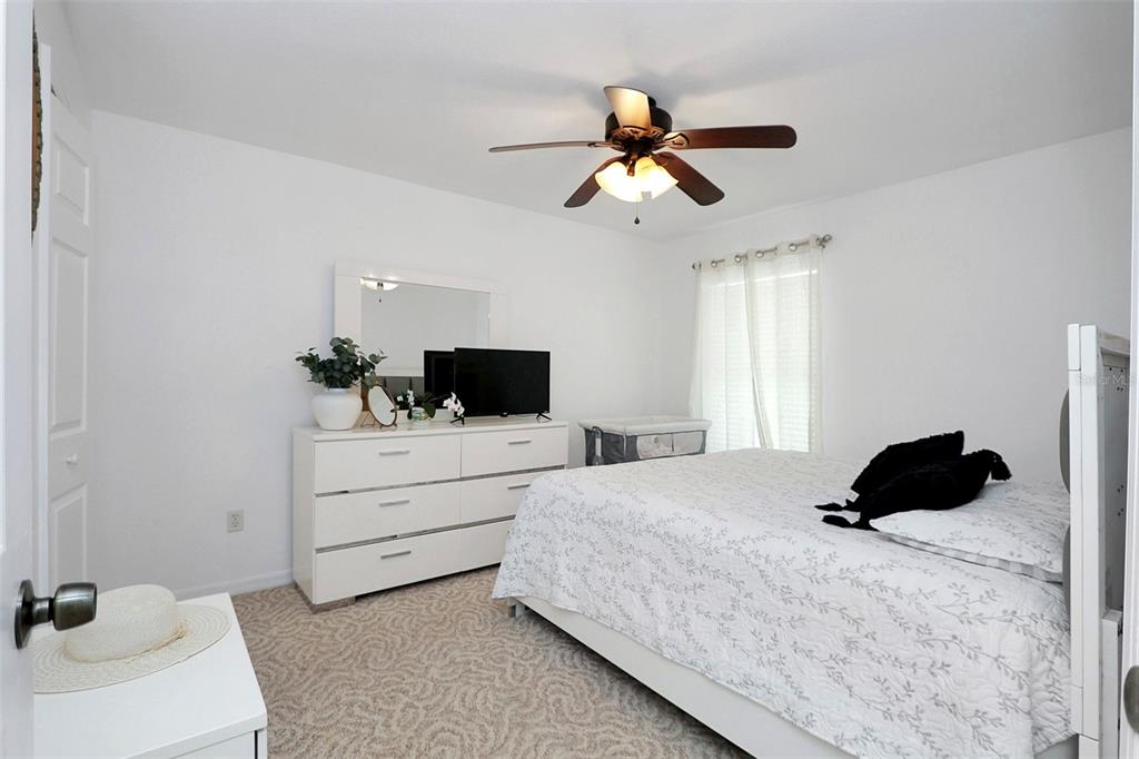 10648 Southwest 38th Avenue Ocala, FL 34476 - Photo 39 of 52 a bedroom with a bed and a television