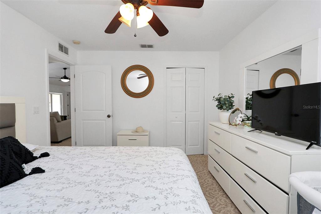 10648 Southwest 38th Avenue Ocala, FL 34476 - Photo 40 of 52 a bedroom with a bed and a dresser