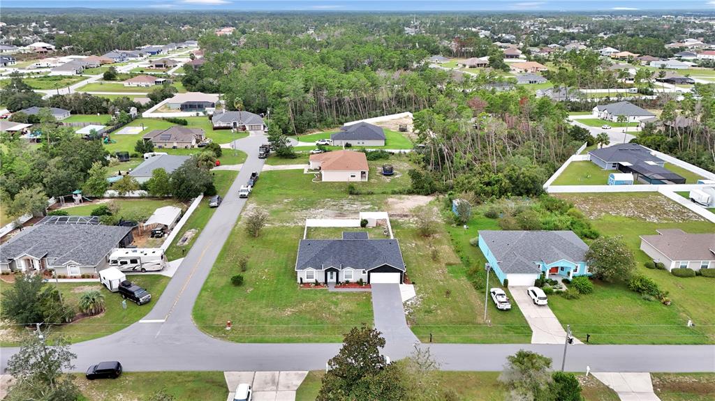 10648 Southwest 38th Avenue Ocala, FL 34476 - Photo 44 of 52 an aerial view of residential houses with outdoor space and parking