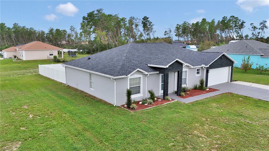 10648 Southwest 38th Avenue Ocala, FL 34476 - Photo 47 of 52 a aerial view of a house with swimming pool and big yard
