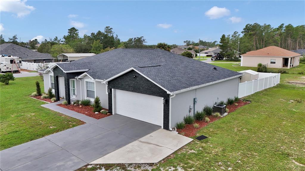 10648 Southwest 38th Avenue Ocala, FL 34476 - Photo 48 of 52 an aerial view of a house with table and chairs