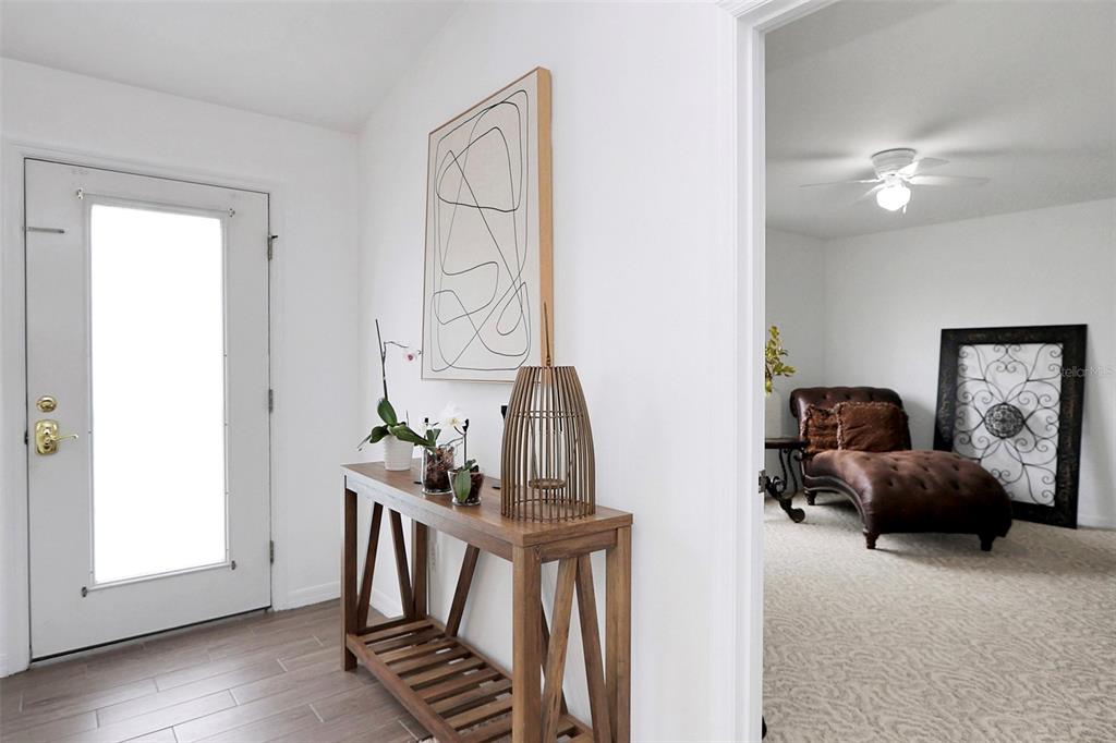 10648 Southwest 38th Avenue Ocala, FL 34476 - Photo 7 of 52 a view of hall way with furniture and entryway