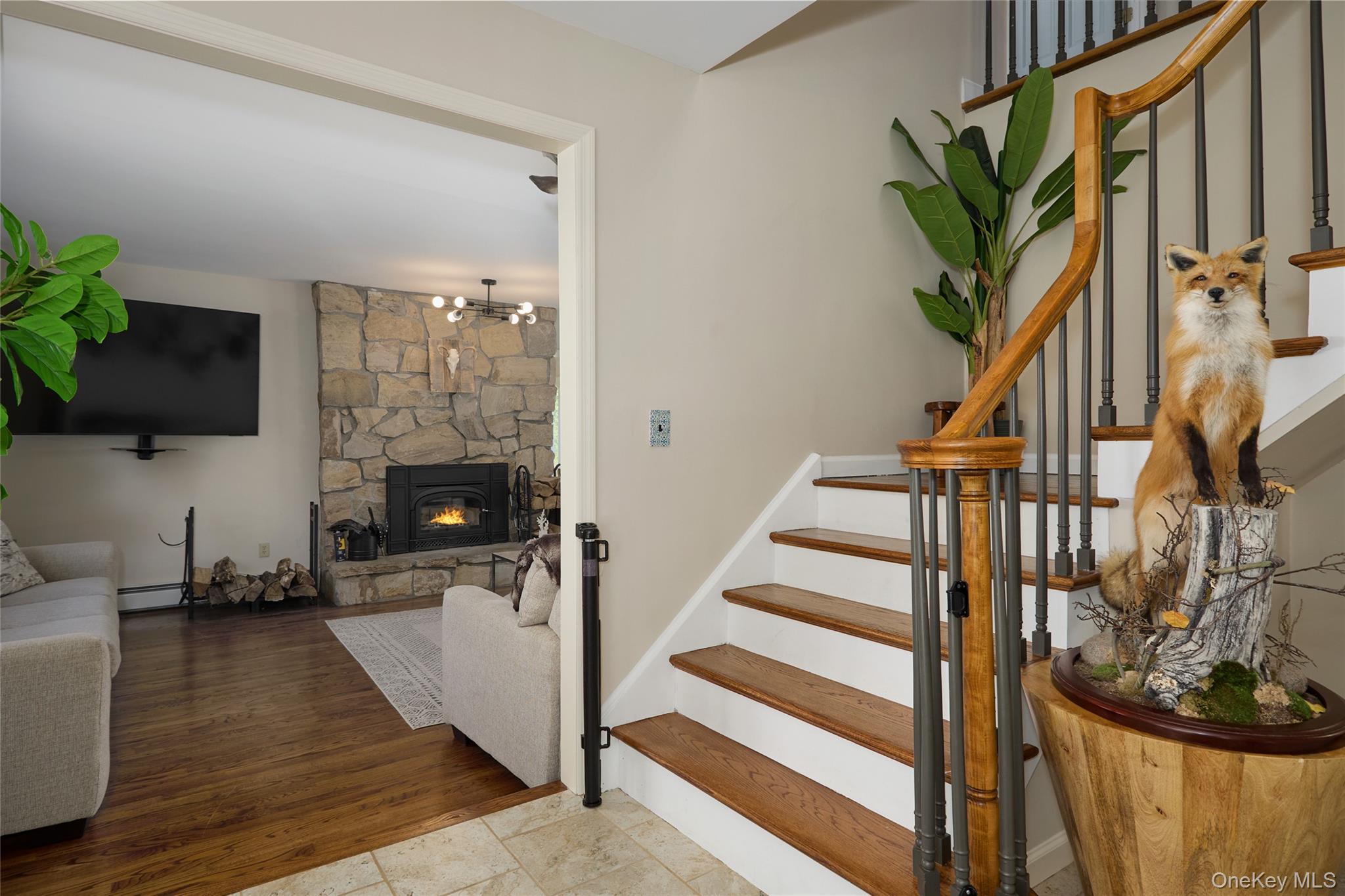 32 Cole Road Pleasant Valley, NY 12569 - Photo 19 of 49 a living room with furniture a fireplace and a flat screen tv